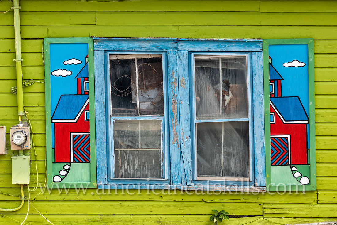 Photograph of painted, artistic house shutters in the northern Catskill village of Tannersville, New York.