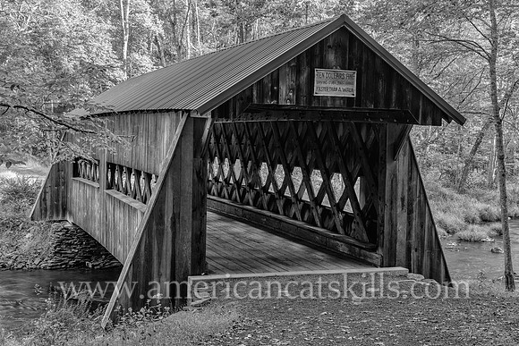 Photograph of the Ashokan-Turnwood Covered Bridge, located at the Ashkokan Center in the Catskills hamlet of Olivebridge, New York.