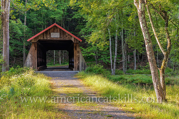 Photograph of the Ashokan-Turnwood Covered Bridge, located at the Ashkokan Center in the Catskills hamlet of Olivebridge, New York.