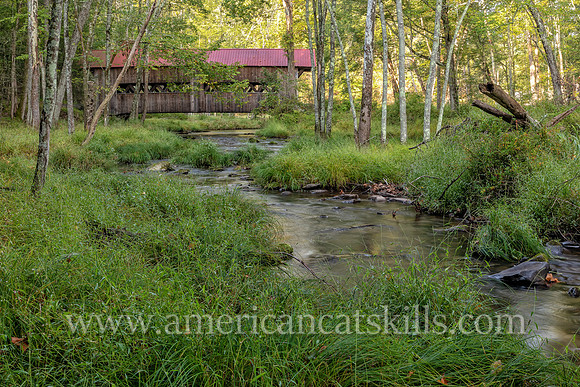 Photograph of the Ashokan-Turnwood Covered Bridge, located at the Ashkokan Center in the Catskills hamlet of Olivebridge, New York.