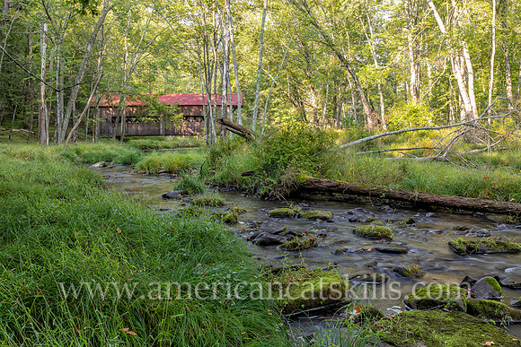 Photograph of the Ashokan-Turnwood Covered Bridge, located at the Ashkokan Center in the Catskills hamlet of Olivebridge, New York.