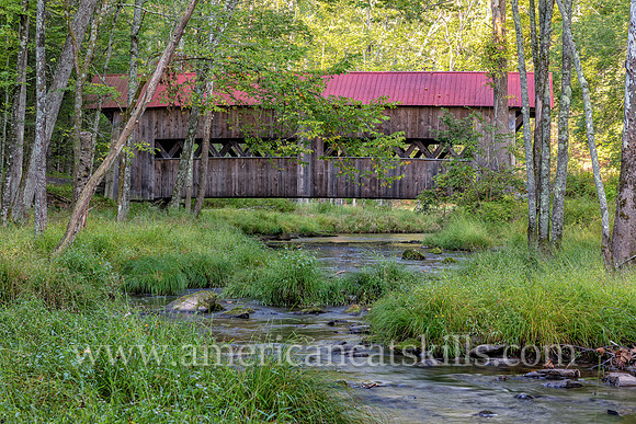 Photograph of the Ashokan-Turnwood Covered Bridge, located at the Ashkokan Center in the Catskills hamlet of Olivebridge, New York.