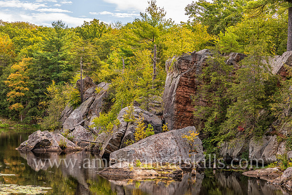 Photograph of rocky cliffs on the pond at the John Burroughs Nature Sanctuary in West Park, New York.