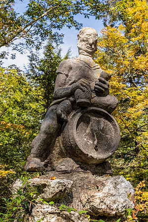 Photograph of a sculpture of a man sitting on top of a keg at the John Burroughs Nature Sanctuary in West Park, New York.
