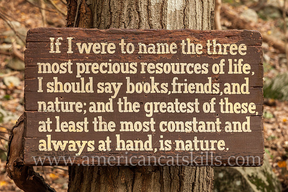 Wooden sign with a famous John Burroughs quote at the John Burroughs Nature Sanctuary in West Park, New York.