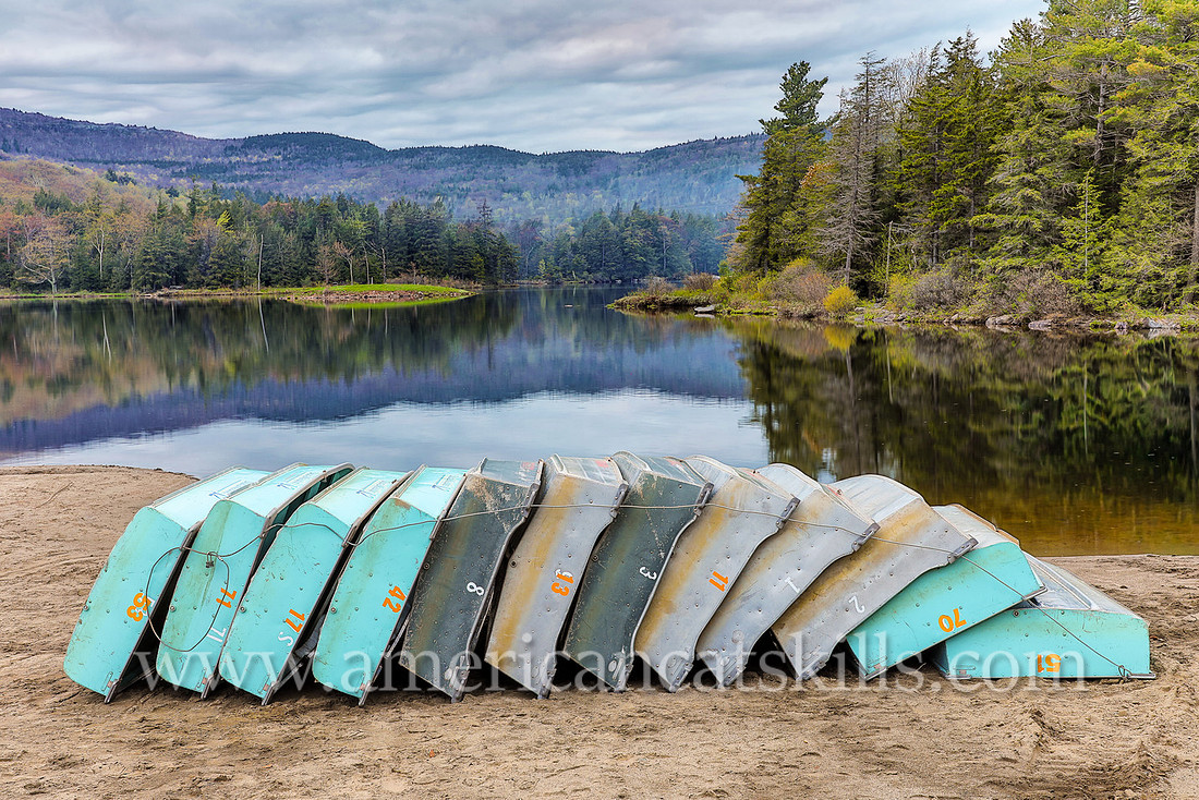 Photographs of rowboats on the beach at North-South Lake in Haines Falls, New York.