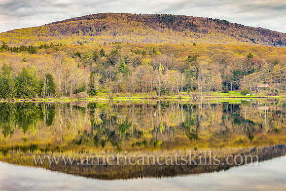 Photograph of the mountain overlooking the lake in springtime at North-South Lake in Haines Falls, New York.