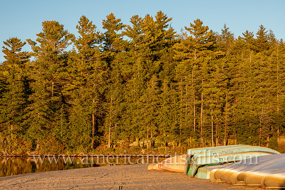 Photograph of kayaks, canoes and rowboats on the shore of North-South Lake in Haines Falls, New York.