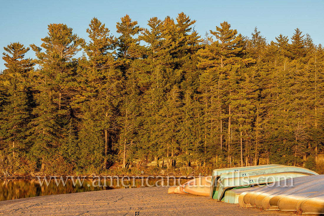 Photograph of kayaks, canoes and rowboats on the shore of North-South Lake in Haines Falls, New York.
