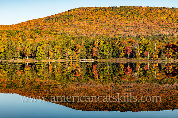 Photograph of a mountain reflecting in the lake at North-South Lake in the Catskills.