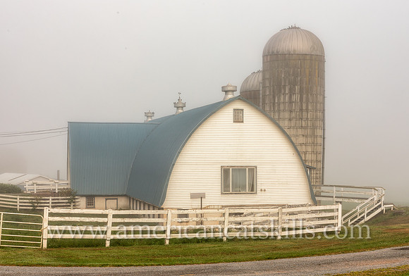 Photograph of the Cattle Exchange barn under deep fog in Delaware County, New York.