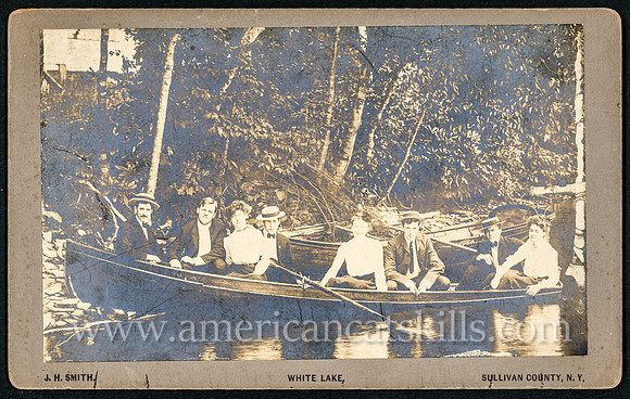 Vintage photograph of a group of friends in a rowboat published by photographer John H. Smith of White Lake, New York.
