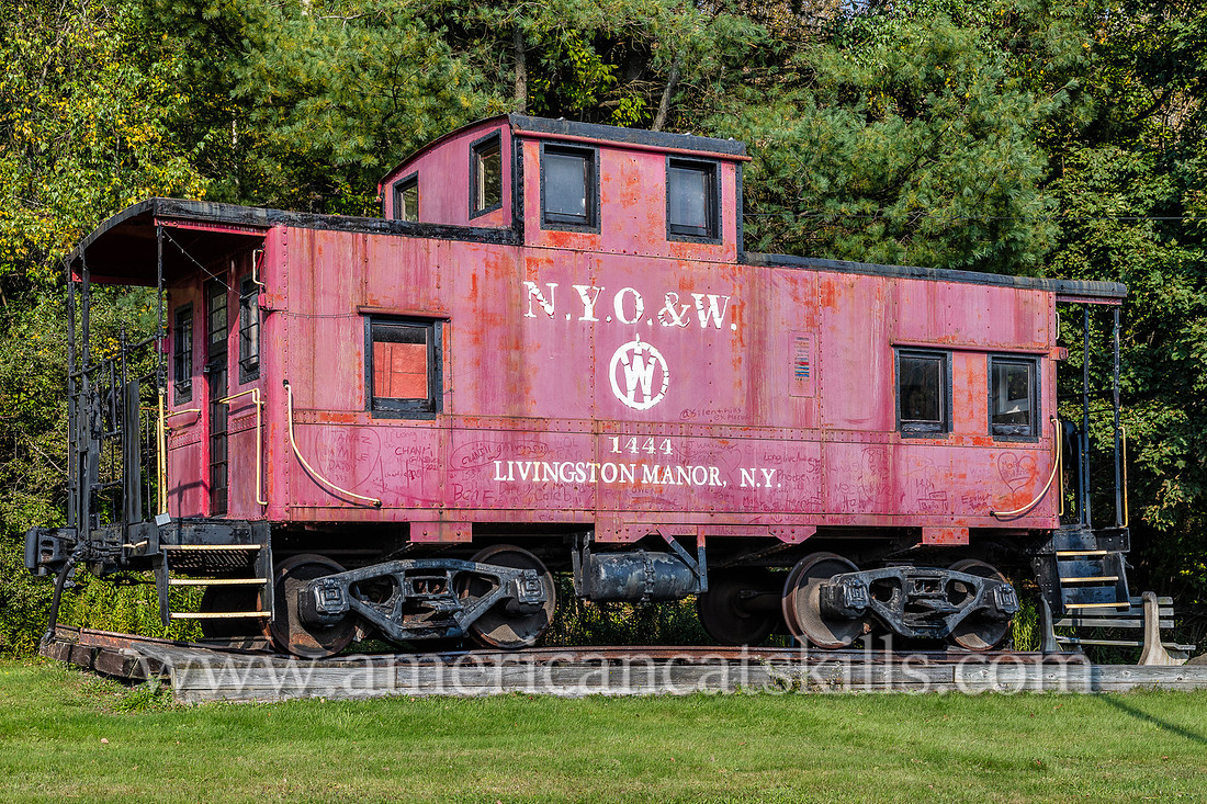 Photograph of the red O&W caboose car located off exit 96 of Route 17 at the entrance of Livingston Manor, New York.