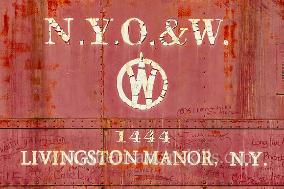 Photograph of the red O&W caboose car located off exit 96 of Route 17 at the entrance of Livingston Manor, New York.