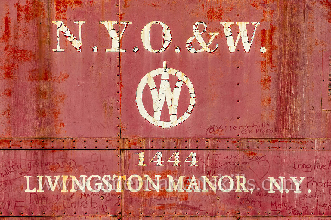 Photograph of the red O&W caboose car located off exit 96 of Route 17 at the entrance of Livingston Manor, New York.