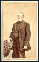 Portrait of an old man standing taken by photographer Henry B. Aldrich of Catskill, New York.