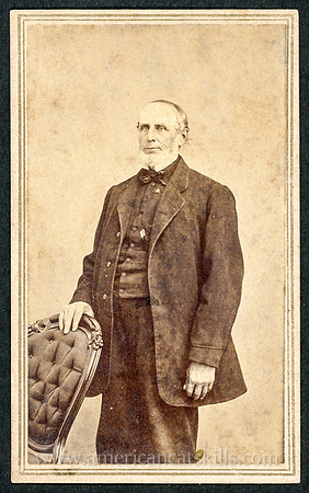 Portrait of an old man standing taken by photographer Henry B. Aldrich of Catskill, New York.