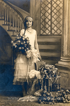 Portrait of a young woman holding flowers taken by the Pennington Studio of Kingston, New York.