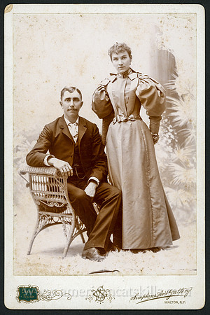 Portrait of a well dressed couple by photographer G. W. Simpkins of Walton, New York.