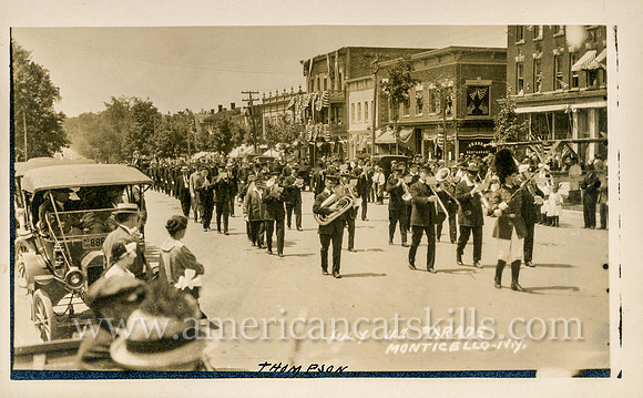 Vintage postcard titled "July 4th Parade, Monticello, N. Y. (2)" published by photographer Howard P. Thompson of Monticello, New York.