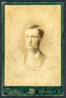 Portrait of a man in a suit by photographer Winfield S. Davis of Ellenville, New York.