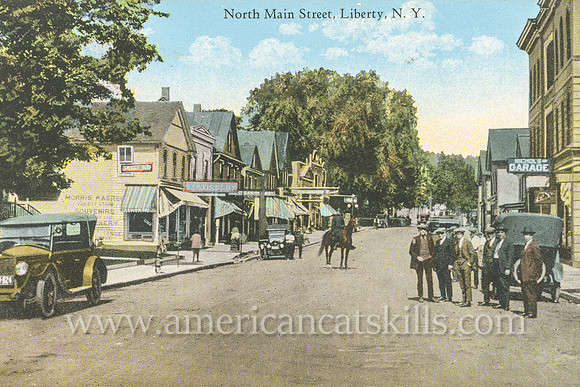 Vintage postcard from photographer Otto Hillig showing North Main Street in the village of Liberty in Sullivan County, New York.
