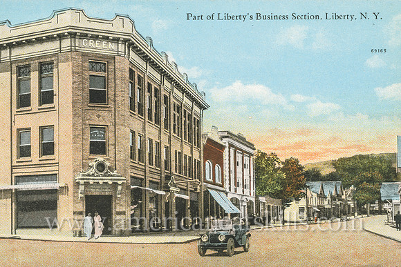 Vintage postcard from photographer Otto Hillig showing the business district in the village of Liberty in Sullivan County, New York.