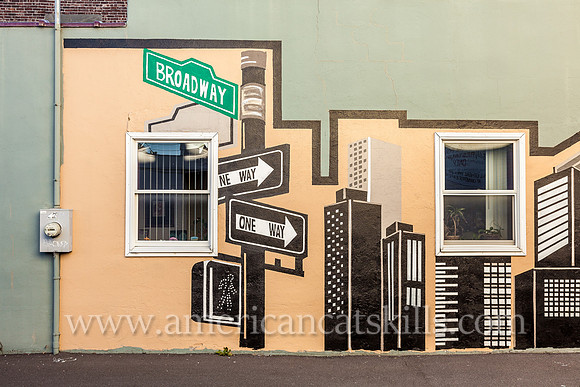 The midtown Kingston mural known as Justice, appropriately located on the side wall of a legal practice, depicts Lady Justice, the scales of justice and a city skyline.