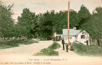 Vintage postcard titled "The Walk - Loch Sheldrake, N. Y." published by the photographic firm of Laidlaw and Wood of Hurleyville, New York.