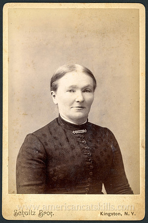 Portrait of a well-dressed Woman by the photographic firm of  Schultz Bros. at Kingston, New York