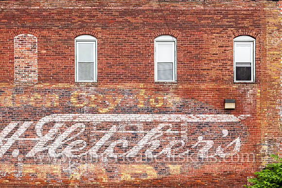 The fading ghost sign for the Fletcher’s Castoria, a well known stomach remedy, can be found in Hancock, New York.