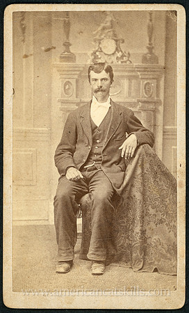 Portrait of a man in a suit by photographer D. J. Auchmoody of Rondout, New York.
