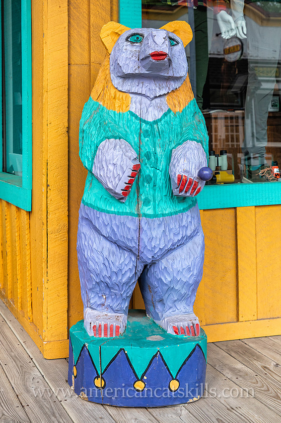 Photograph of a colorful bear statue in the northern Catskills village of Tannersville, New York.