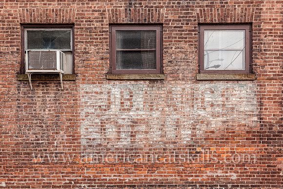 Ghost sign advertising the long-gone J.B. Mance Pharmacy in the village of Liberty, Sullivan County, New York.