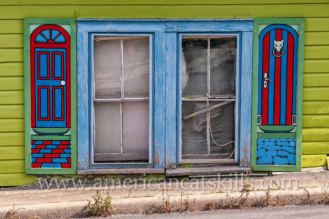 Photograph of painted, artistic house shutters in the northern Catskill village of Tannersville, New York.