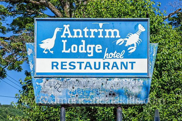 Photograph of an abandoned sign for the historic Antrim Lodge, located in the hamlet of Roscoe in Sullivan County, New York.