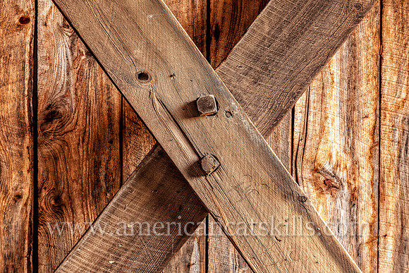 The Millbrook Covered Bridge demonstrates the Town Lattice truss, which includes the use of wooden “tree nails,” or trunnels, to connect the diagonal timbers used to hold the bridge together.