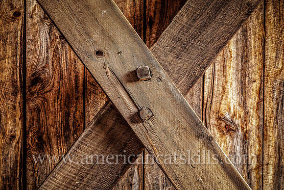 The Millbrook Covered Bridge demonstrates the Town Lattice truss, which includes the use of wooden “tree nails,” or trunnels, to connect the diagonal timbers used to hold the bridge together.