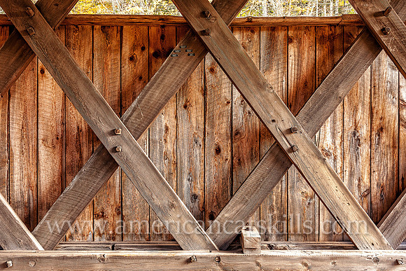 The Millbrook Covered Bridge demonstrates the Town Lattice truss, which includes the use of wooden “tree nails,” or trunnels, to connect the diagonal timbers used to hold the bridge together.