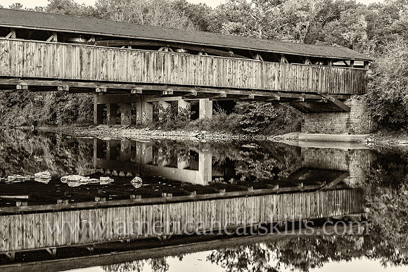 The historic Perrine’s Covered Bridge, constructed in 1835 by Benjamin Wood, crosses the Wallkill River in the hamlet of Rifton in Ulster County, New York.