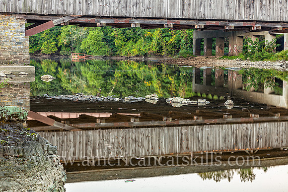 The historic Perrine’s Covered Bridge, constructed in 1835 by Benjamin Wood, crosses the Wallkill River in the hamlet of Rifton in Ulster County, New York.