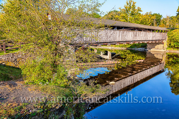 The historic Perrine’s Covered Bridge, constructed in 1835 by Benjamin Wood, crosses the Wallkill River in the hamlet of Rifton in Ulster County, New York.