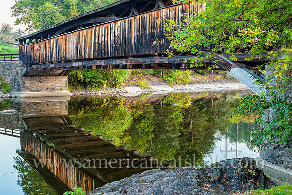 The historic Perrine’s Covered Bridge, constructed in 1835 by Benjamin Wood, crosses the Wallkill River in the hamlet of Rifton in Ulster County, New York.