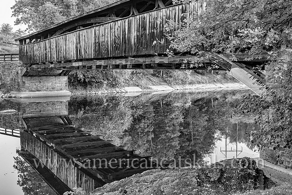The historic Perrine’s Covered Bridge, constructed in 1835 by Benjamin Wood, crosses the Wallkill River in the hamlet of Rifton in Ulster County, New York.