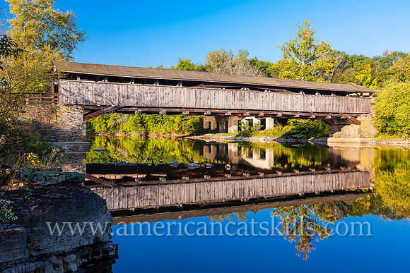 The historic Perrine’s Covered Bridge, constructed in 1835 by Benjamin Wood, crosses the Wallkill River in the hamlet of Rifton in Ulster County, New York.