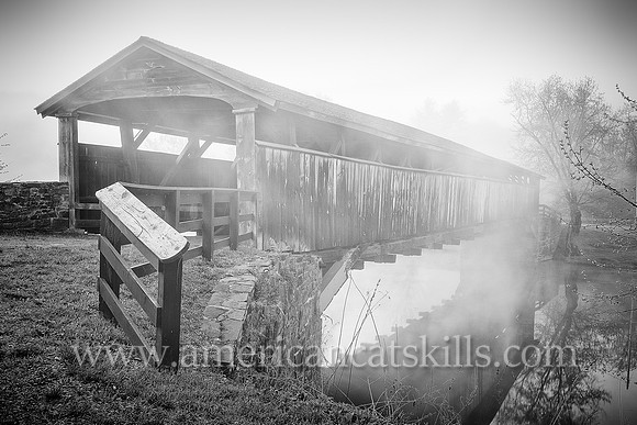 The historic Perrine’s Covered Bridge, constructed in 1835 by Benjamin Wood, crosses the Wallkill River in the hamlet of Rifton in Ulster County, New York.