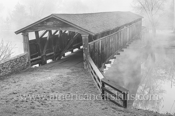 The historic Perrine’s Covered Bridge, constructed in 1835 by Benjamin Wood, crosses the Wallkill River in the hamlet of Rifton in Ulster County, New York.