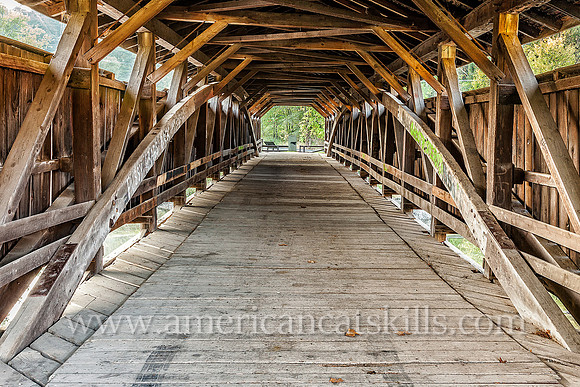 The historic Perrine’s Covered Bridge, constructed in 1835 by Benjamin Wood, crosses the Wallkill River in the hamlet of Rifton in Ulster County, New York.
