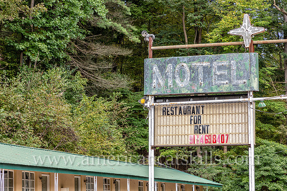 Old fashioned ghost sign for “Motel” at an abandoned motel and restaurant at Pond Eddy in Sullivan County, New York.