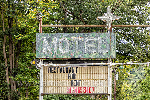 Old fashioned ghost sign for “Motel” at an abandoned motel and restaurant at Pond Eddy in Sullivan County, New York.